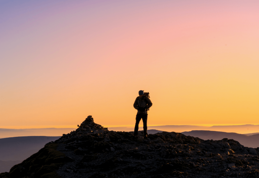 LAKE DISTRICT ADVENTURING - SOCIAL POST MAN ON SUNSET ON HELVELLYN