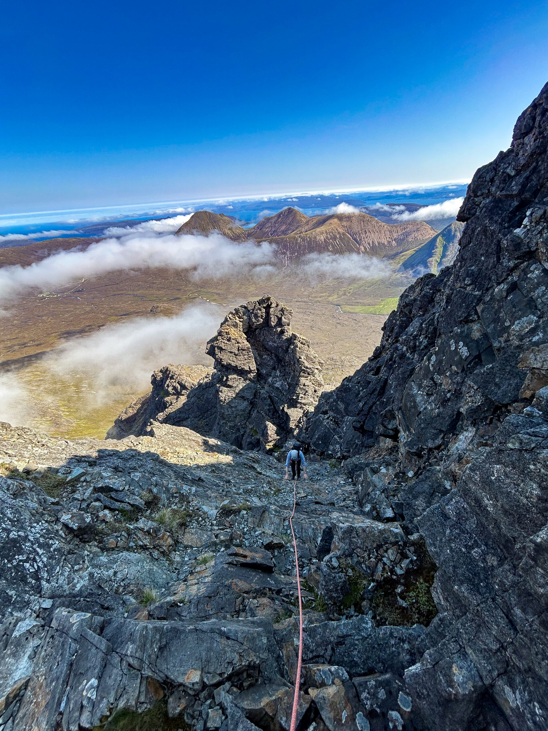 Lake District mountain guiding : Climber with guide Jack from Adventuring on Skye climbing on the cullin ridge